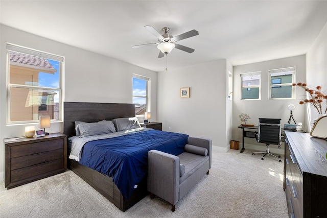 2505 Moreno St, Austin, TX 78723 - bedroom featuring light carpet, an office area, a ceiling fan, and baseboards
