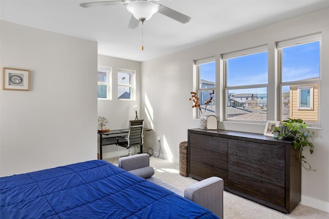 2505 Moreno St, Austin, TX 78723 - bedroom with light carpet, baseboards, multiple windows, and a ceiling fan