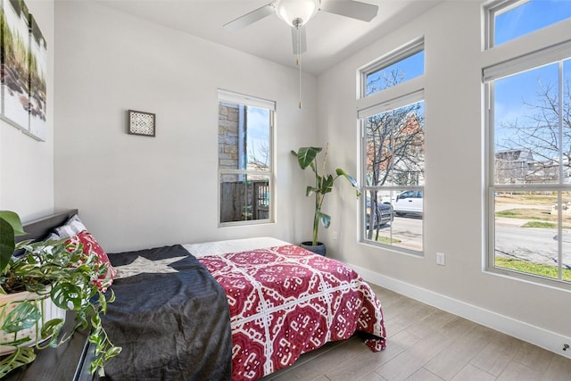 2505 Moreno St, Austin, TX 78723 - bedroom with baseboards, ceiling fan, and wood finished floors