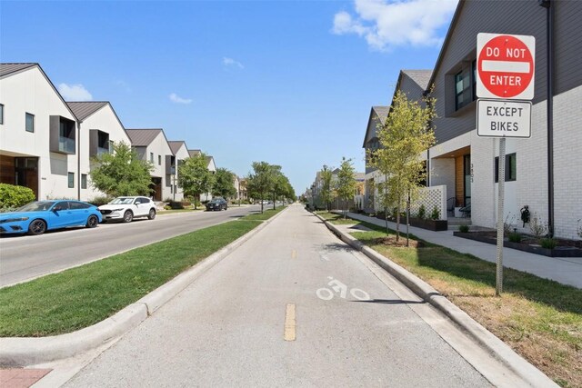 2505 Moreno St, Austin, TX 78723 - view of asphalt road with a residential view, curbs, and sidewalks