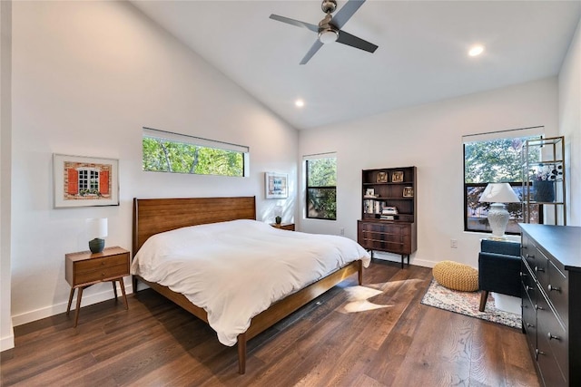 bedroom featuring baseboards, lofted ceiling, and dark wood-type flooring