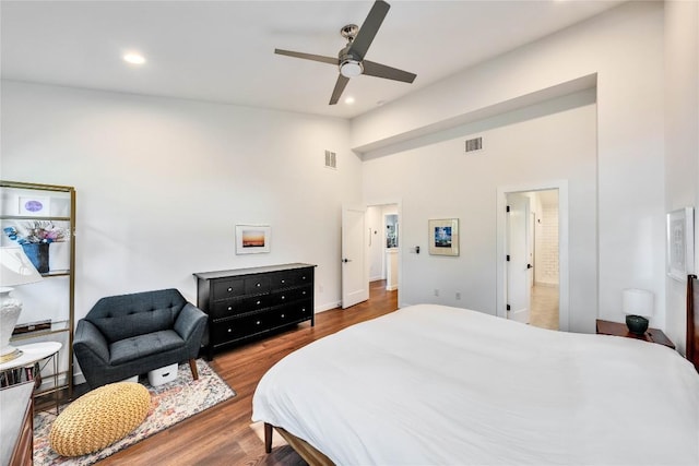 bedroom with recessed lighting, visible vents, lofted ceiling, and wood finished floors