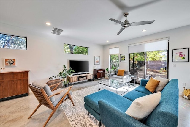 living room with recessed lighting, visible vents, finished concrete floors, and a ceiling fan