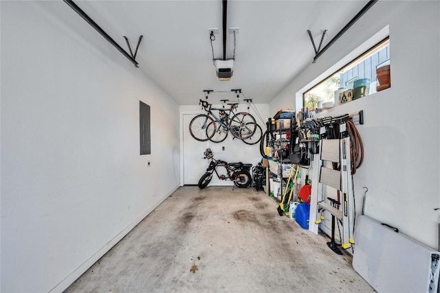 garage featuring electric panel, a garage door opener, and bike storage