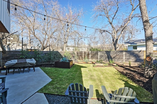 view of yard with a fenced backyard and a patio area