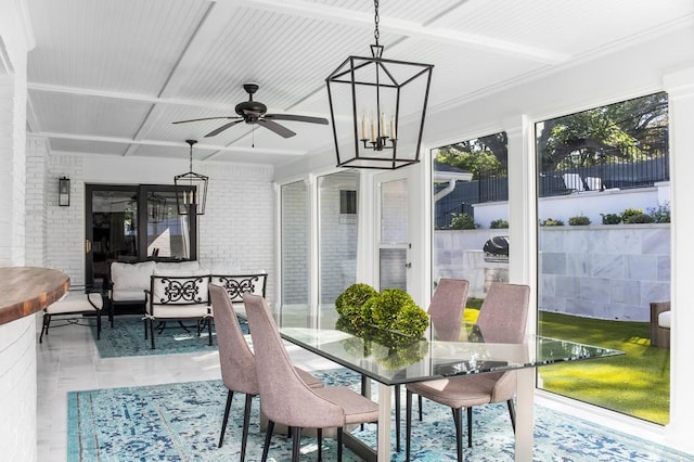 sunroom with ceiling fan