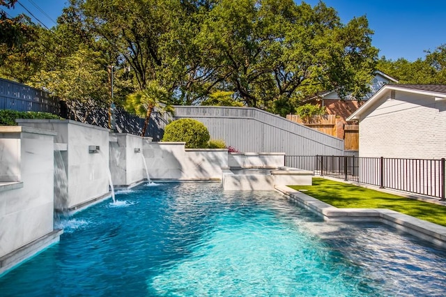 view of pool featuring a fenced backyard, a fenced in pool, and a hot tub