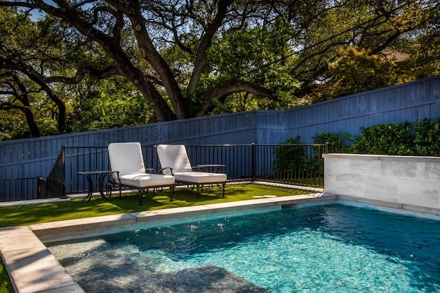 view of swimming pool featuring a fenced in pool and a fenced backyard