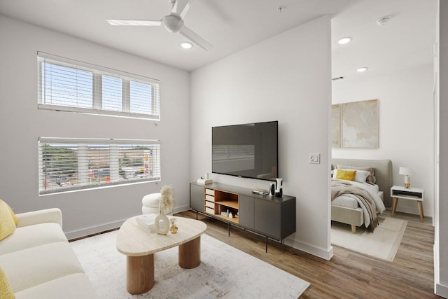 living room with recessed lighting, baseboards, wood finished floors, and a ceiling fan