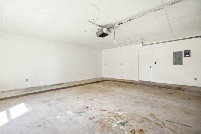 garage featuring electric panel and a garage door opener