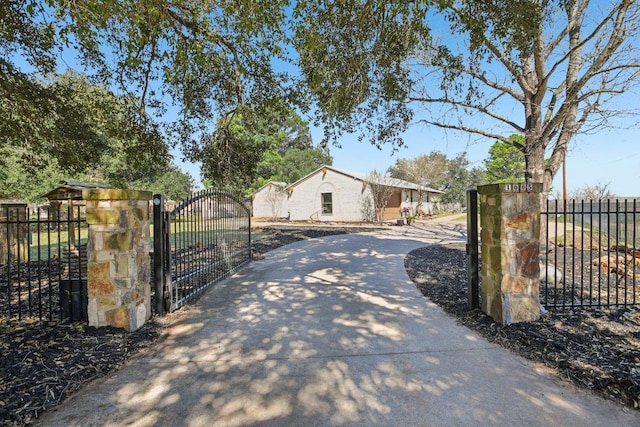 view of gate featuring fence