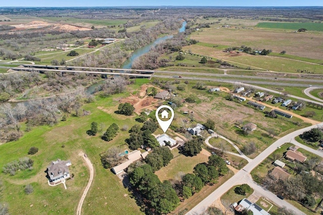 birds eye view of property featuring a rural view