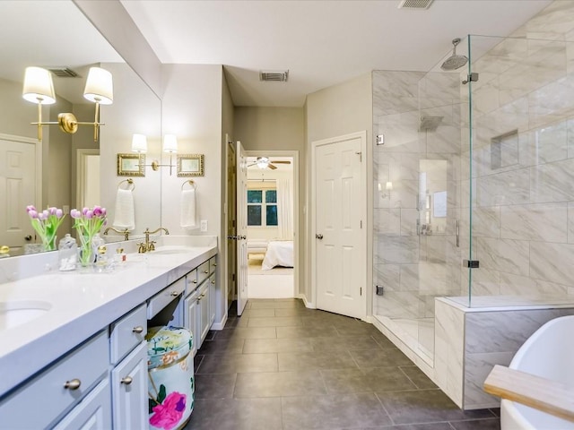 bathroom featuring visible vents, a stall shower, a sink, connected bathroom, and double vanity