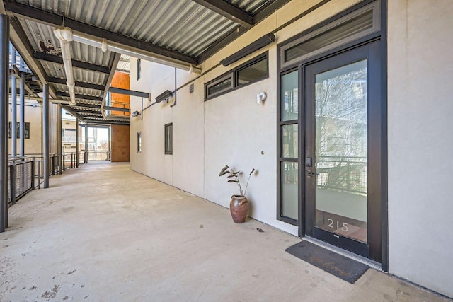 property entrance featuring stucco siding