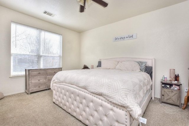 bedroom featuring a ceiling fan, carpet, and visible vents