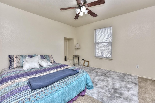 carpeted bedroom featuring a ceiling fan