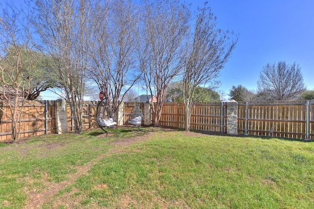 view of yard with a fenced backyard