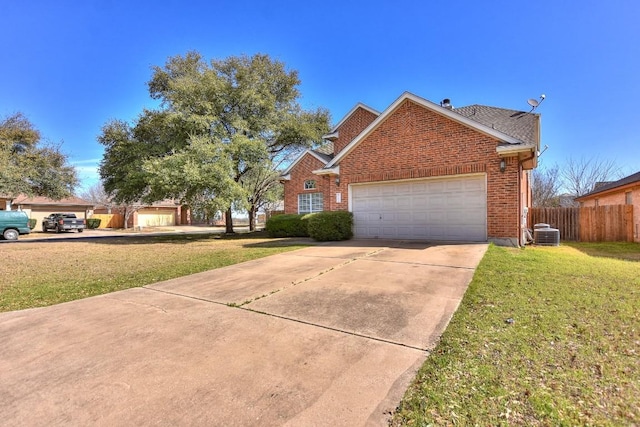 view of front of house with central air condition unit, fence, concrete driveway, a front yard, and brick siding