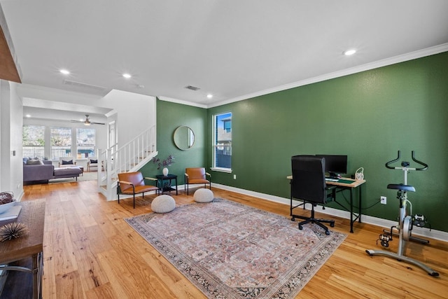 office area featuring visible vents, ornamental molding, baseboards, and wood-type flooring