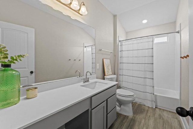 full bathroom with shower / tub combo with curtain, toilet, vanity, and wood finish floors