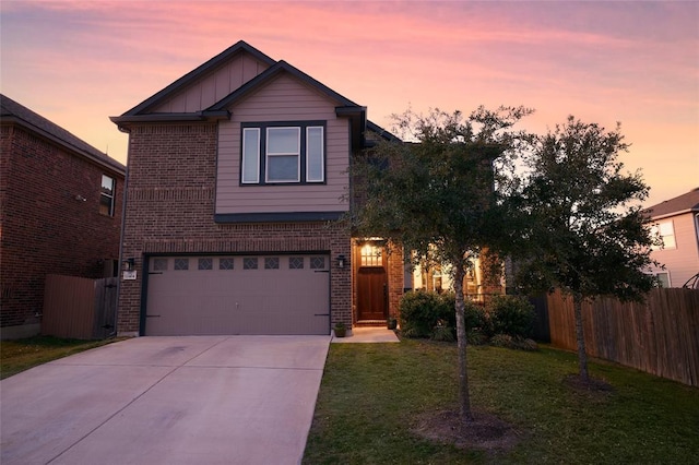 traditional home with fence, brick siding, board and batten siding, and driveway