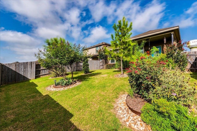 view of yard with a fenced backyard