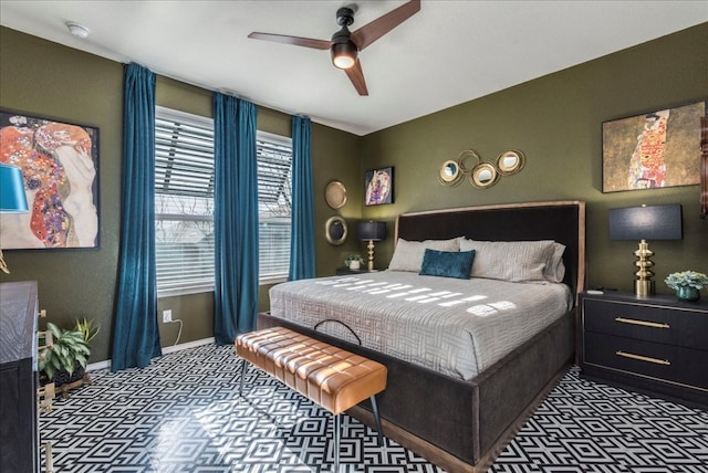 bedroom featuring carpet flooring, baseboards, and a ceiling fan