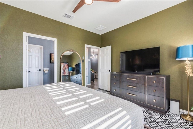 bedroom featuring a ceiling fan and visible vents