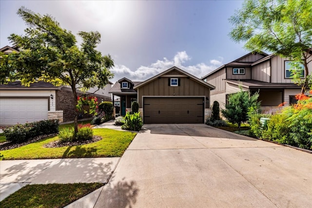 view of front of home with stone siding, board and batten siding, concrete driveway, and an attached garage