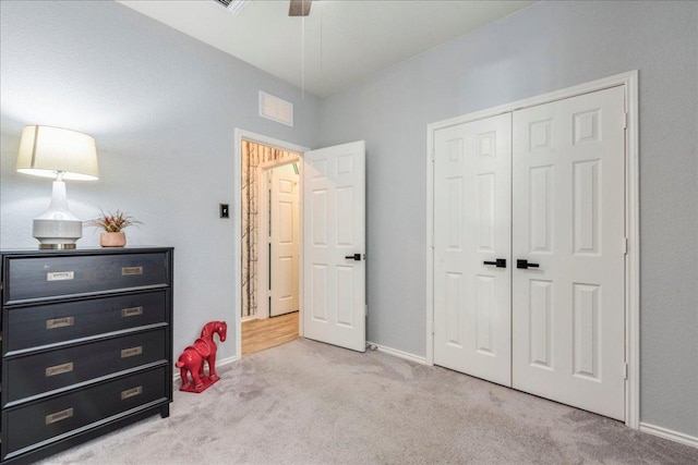 bedroom featuring a closet, carpet floors, and baseboards