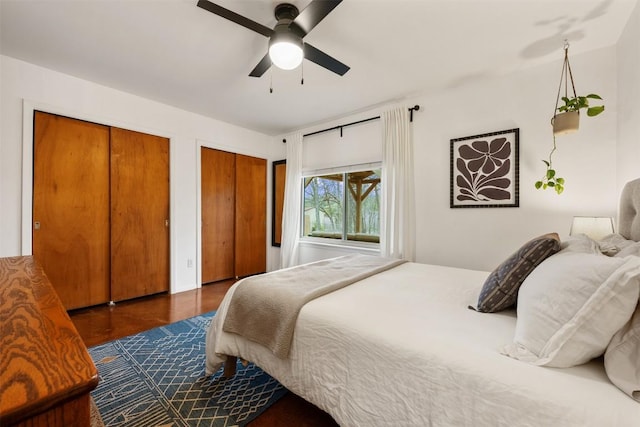 bedroom featuring two closets and ceiling fan