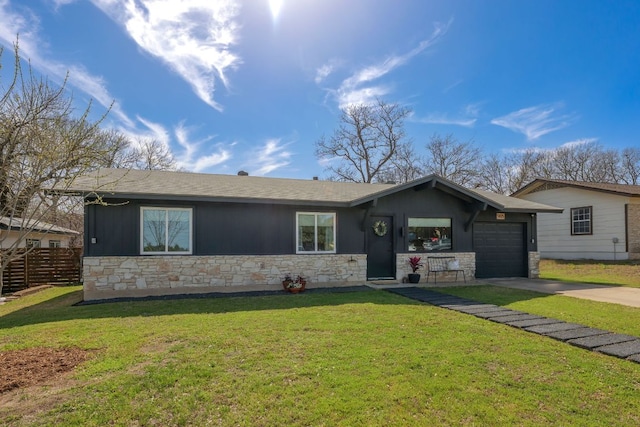 ranch-style home featuring stone siding, an attached garage, concrete driveway, and fence