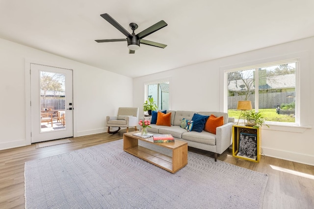 905 Turtle Creek Blvd, Austin, TX 78745 - living room featuring healthy amount of natural light, wood finished floors, a ceiling fan, baseboards, and vaulted ceiling