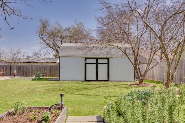 view of shed featuring a fenced backyard