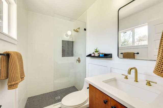 full bath featuring a walk in shower, toilet, and vanity