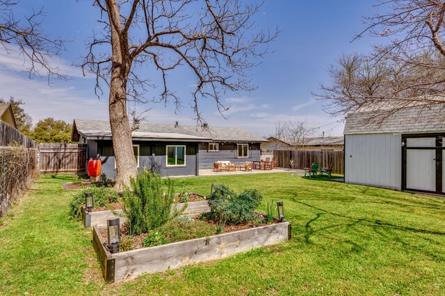 905 Turtle Creek Blvd, Austin, TX 78745 - fenced backyard featuring a garden, a storage shed, and a patio area