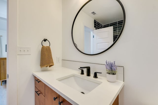 bathroom featuring visible vents and vanity