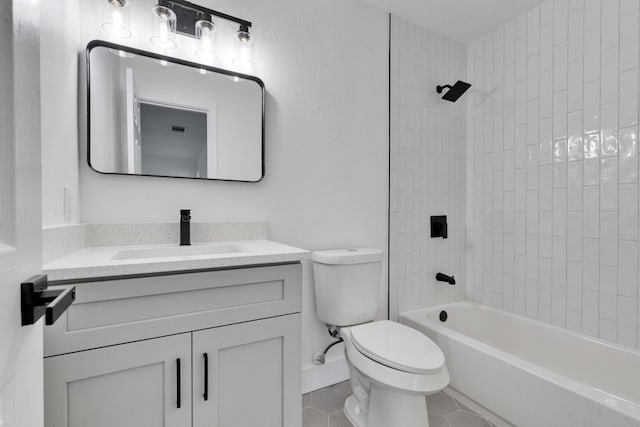 bathroom featuring vanity, tile patterned floors, toilet, and bathtub / shower combination