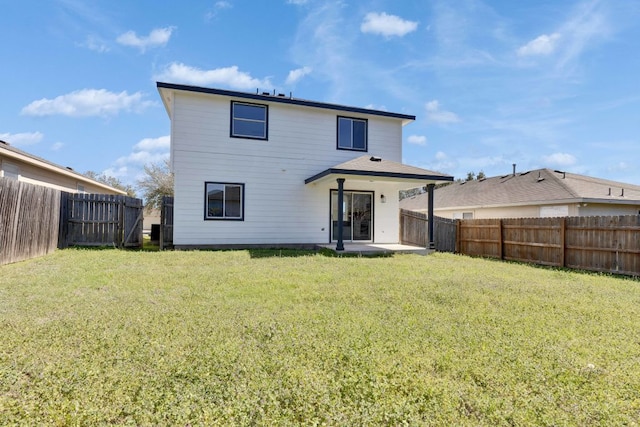 back of house featuring a patio area, a yard, and a fenced backyard