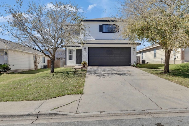 traditional-style home with a front yard, concrete driveway, and an attached garage