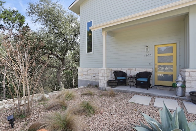 view of exterior entry featuring stone siding