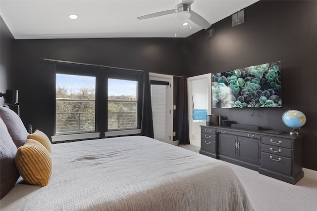 bedroom featuring vaulted ceiling, carpet flooring, a ceiling fan, and visible vents