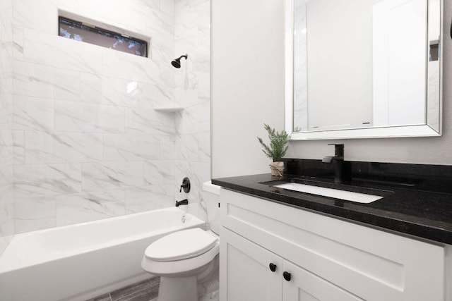 bathroom with toilet, shower / washtub combination, and vanity