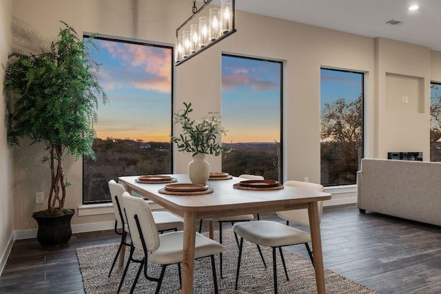 dining area with recessed lighting, baseboards, and dark wood-style flooring