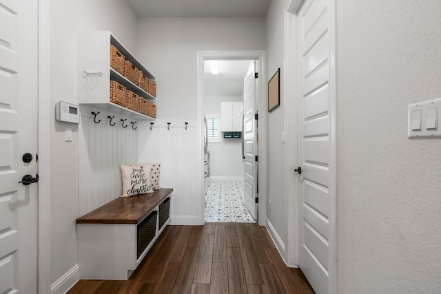 mudroom with dark wood-style floors