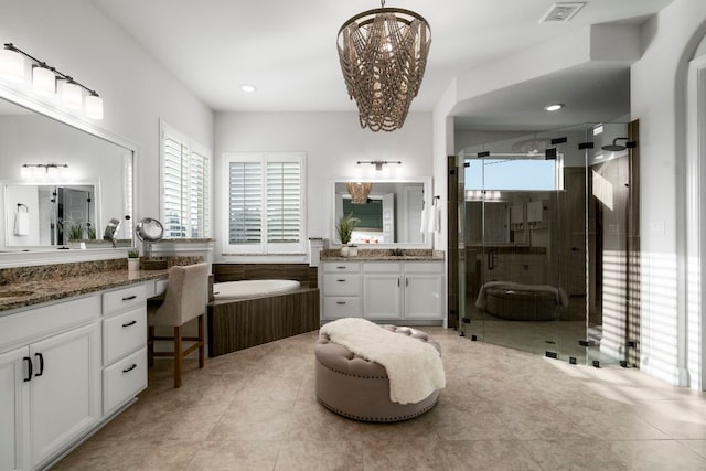 bathroom featuring a shower stall, visible vents, a wealth of natural light, and a sink