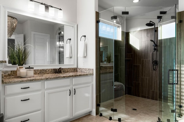 bathroom with vanity and a stall shower