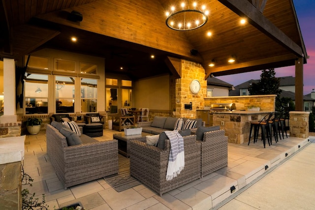 view of patio / terrace with outdoor wet bar, an outdoor kitchen, and outdoor lounge area