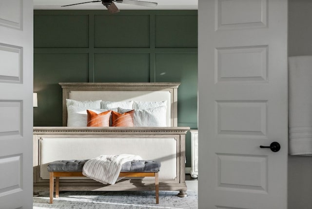 bedroom featuring a decorative wall