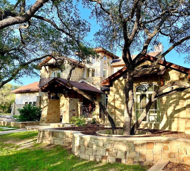 23923 Tres Coronas, Spicewood, TX 78669 - view of front of home featuring stone siding